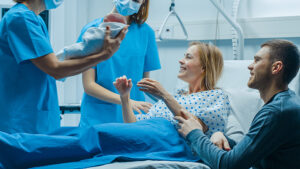 Labor and Delivery give Newborn Baby to a Mother to Hold